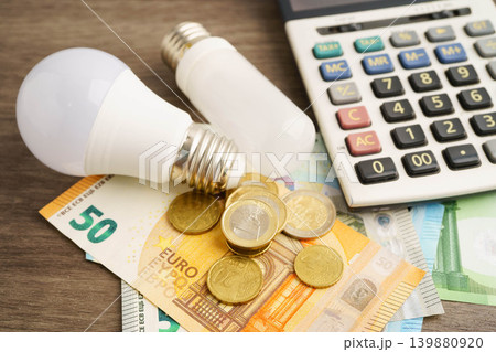 Cost of electric utilities with light bulb for payment. 139880920