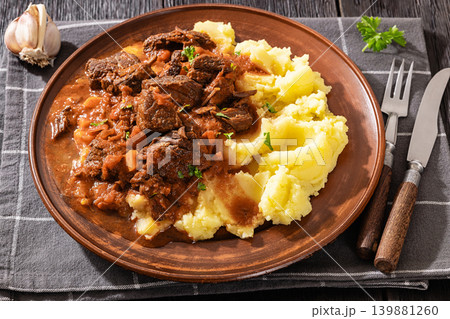 slow cooked beef meat stew served with mashed potatoes 139881260
