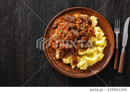slow cooked beef meat stew served with mashed potatoes slow cooked beef meat stew served with mashed potatoes 139881268
