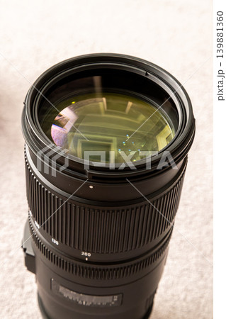 Close-up of Telephoto Camera Lens on Textured Surface Close-up of Telephoto Camera Lens on Textured Surface 139881360