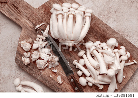 Freshly sliced Shimizhi mushrooms, on a wooden chopping board, ready to cook, close-up, no people, 139881681