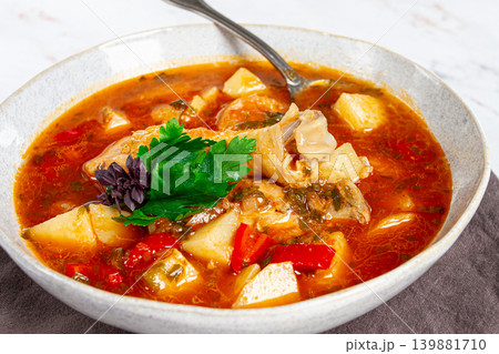 Souzi soup. Georgian dish, meat with oats, tomato sauce and herbs, 139881710