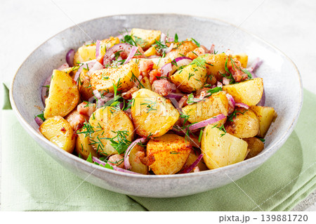German potato salad, with bacon, onion and herbs, served in a bowl, homemade, no people, 139881720