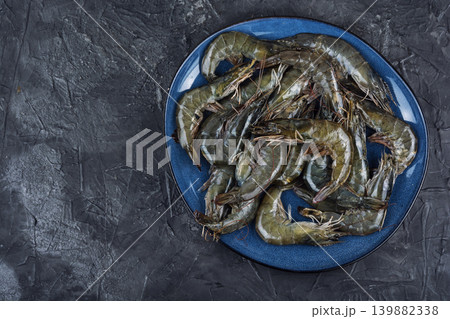 Fresh uncooked langoustines on plates ready for cooking. Fresh uncooked langoustines on plates ready for cooking. 139882338