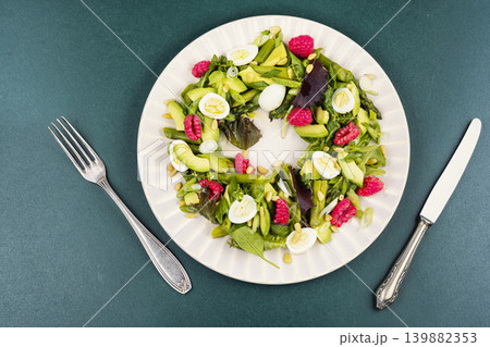 Healthy Asparagus and Avocado Salad with Quail Eggs and Fresh Raspberries Healthy Asparagus and Avocado Salad with Quail Eggs and Fresh Raspberries 139882353