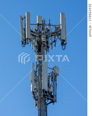 The top section of a high telecommunications tower 139882438