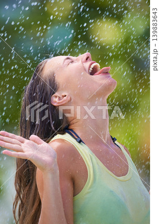 Tasting rain, happiness and woman with celebration, nature and cheerful with joy and winter air. Person, outdoor or girl with excitement or wellness with expression or wet with stress relief or storm Tasting rain, happiness and woman with celebration, nature and cheerful with joy and winter air. Person, outdoor or girl with excitement or wellness with expression or wet with stress relief or storm 139883643