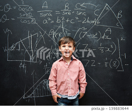 Child, boy and face or excited by blackboard with letters, numbers and education in classroom at school. Kid, student and happy for knowledge, learning and chalkboard with math, drawing and preschool Child, boy and face or excited by blackboard with letters, numbers and education in classroom at school. Kid, student and happy for knowledge, learning and chalkboard with math, drawing and preschool 139883644
