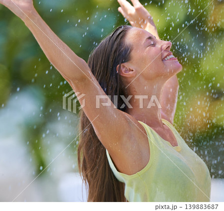 Stretching, rain and happy with woman, celebration and freedom with a break and excited. Outdoor, person or girl in a park, wet or carefree with excitement or cheerful with victory, winter or winning Stretching, rain and happy with woman, celebration and freedom with a break and excited. Outdoor, person or girl in a park, wet or carefree with excitement or cheerful with victory, winter or winning 139883687
