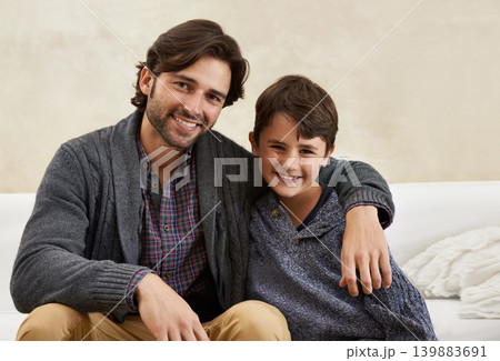 Sofa, hug and portrait of father and child for bonding, happy relationship and relax on weekend together. Family, parents and dad embrace young son on couch for love, care and smile in living room Sofa, hug and portrait of father and child for bonding, happy relationship and relax on weekend together. Family, parents and dad embrace young son on couch for love, care and smile in living room 139883691