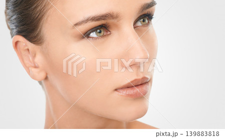 Woman, natural makeup and glow with vision for beauty, skincare and cosmetology in studio closeup. Female person, thinking or planning for flawless skin and moisturizing treatment on white background 139883818
