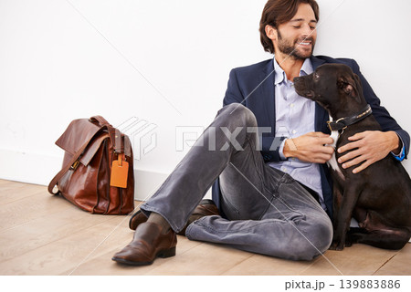 Smile, love and happy businessman with dog for bonding together with positive and good attitude. Career, briefcase and professional male person playing with pet, puppy or animal on floor at home. Smile, love and happy businessman with dog for bonding together with positive and good attitude. Career, briefcase and professional male person playing with pet, puppy or animal on floor at home. 139883886