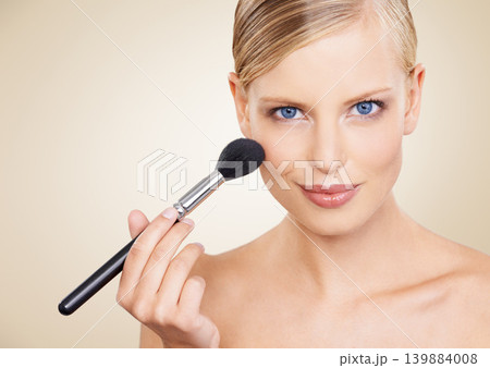 Cosmetics, brush and mockup portrait of woman in studio with confidence, makeup or facial glow. Glamour, beauty and happy face of girl on beige background space with healthy skin, shine and wellness. Cosmetics, brush and mockup portrait of woman in studio with confidence, makeup or facial glow. Glamour, beauty and happy face of girl on beige background space with healthy skin, shine and wellness. 139884008
