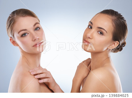 Woman, portrait and models in skincare with beauty, makeup or cosmetics on a blue studio background. Young female person or people with diversity in facial treatment, spa or salon on mockup space Woman, portrait and models in skincare with beauty, makeup or cosmetics on a blue studio background. Young female person or people with diversity in facial treatment, spa or salon on mockup space 139884025
