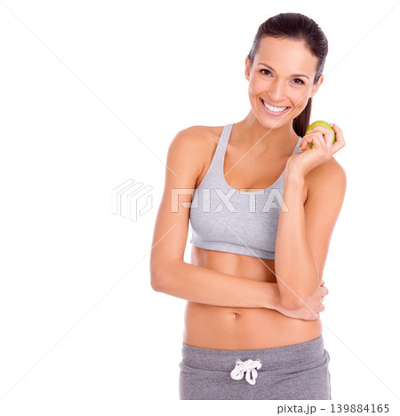 Fitness, apple and portrait of woman in studio with snack for weight loss, health and wellness diet. Smile, nutrition and female person eating organic and fresh fruit by white background with mockup. Fitness, apple and portrait of woman in studio with snack for weight loss, health and wellness diet. Smile, nutrition and female person eating organic and fresh fruit by white background with mockup. 139884165