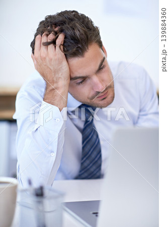 Laptop, depression and business man with stress, fail or mistake with bad news in office. Computer, frustrated or serious professional with bankruptcy, taxes or challenge of financial crisis on email 139884360
