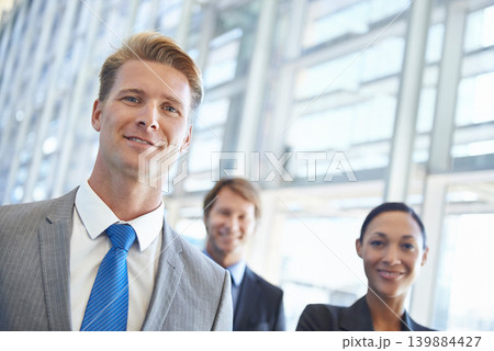 Businessman, portrait and confidence in career, office and pride in profession. Business people, teamwork and collaboration or support in workplace, smiling and entrepreneur of startup company Businessman, portrait and confidence in career, office and pride in profession. Business people, teamwork and collaboration or support in workplace, smiling and entrepreneur of startup company 139884427