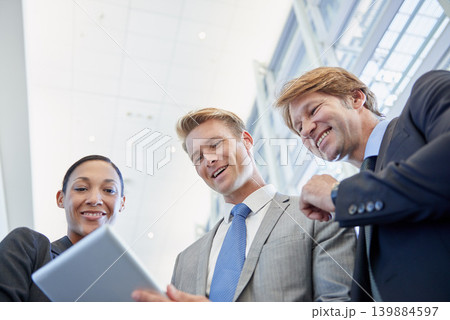 Business people, tablet and support for project in office, collaboration and unity for proposal. Staff, workplace and teamwork for reading a report, partnership and online for review and networking 139884597