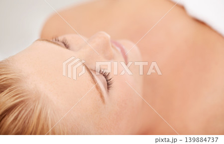 Relax, rest and face of woman at spa for luxury holistic treatment, facial health and professional massage therapy. Self care, peace and smile, happy girl on bed for body wellness and sleep at hotel. Relax, rest and face of woman at spa for luxury holistic treatment, facial health and professional massage therapy. Self care, peace and smile, happy girl on bed for body wellness and sleep at hotel. 139884737