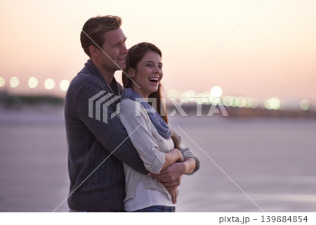 Love, embrace and couple on beach at sunset with happiness together on holiday in Florida. Travel, vacation and man hug woman outdoor on date in summer with care, support and kindness in marriage 139884854