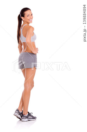 Studio, model and happy in portrait for exercise in gym clothes, training and weight loss by white background. Confident woman, face or strong body of aerobics workout, glow or commitment to fitness 139884894