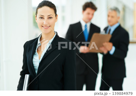 Girl, portrait and team in background of workplace with smile for business of corporate company. Person, happy and professional as employee with suit and collaboration with leader to work for job Girl, portrait and team in background of workplace with smile for business of corporate company. Person, happy and professional as employee with suit and collaboration with leader to work for job 139884979