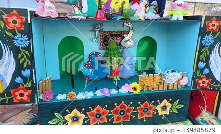 Close up of miniature puppet theater scenery showing traditional artistic design, cultural research study. Close up of miniature puppet theater scenery showing traditional artistic design, cultural research study. 139885879
