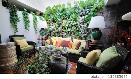 This is a living room with a sofa and garden This is a living room with a sofa and garden 139885985