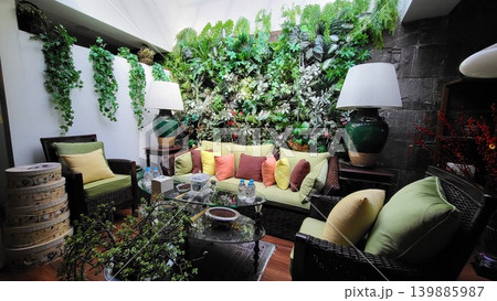 This is a living room with a sofa and garden This is a living room with a sofa and garden 139885987