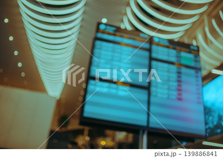 Departure board at airport, abstract out of focus background Departure board at airport, abstract out of focus background 139886841