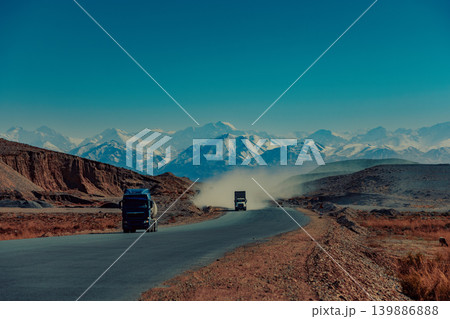 Trucks on high mountains road, Kyrgyzstan Trucks on high mountains road, Kyrgyzstan 139886888