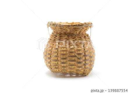 Bamboo basket hand made  Used for putting various devices isolated on white background. 139887554