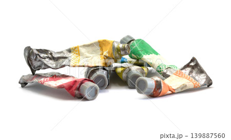 Close-up Old tube of artist oil paint with many colors on white background with copy space 139887560