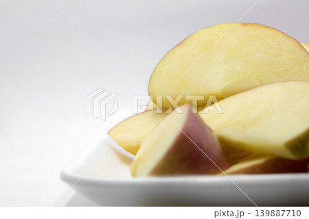 Close-up apple red knife dissect on white background Close-up apple red knife dissect on white background 139887710