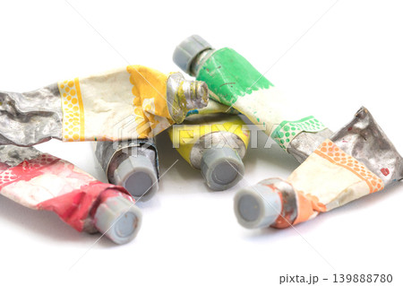 Close-up Old tube of artist oil paint with many colors on white background with copy space 139888780