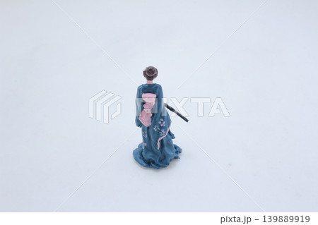 a Miniature traditional figure holding sword kneeling pose a Miniature traditional figure holding sword kneeling pose 139889919