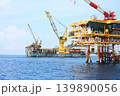Rig along side the offshore platform for operation. Oil and gas industry in the gulf or the sea for operation. Maintenance and operation service with the construction platform by engineer. 139890056