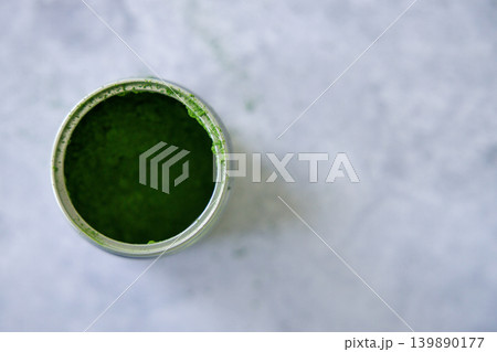 Closeup of can of fresh matcha powder, green tea powder. Closeup of can of fresh matcha powder, green tea powder. 139890177
