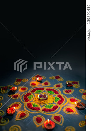 Clay diya lamps lit during diwali celebration, Diwali, or Deepavali, is India's biggest and most important holiday. 139891459