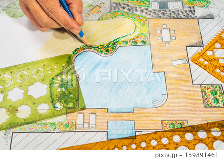 Garden design courses student is learning garden plan design by hand drawing. Garden design courses student is learning garden plan design by hand drawing. 139891461