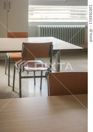 Empty Classroom With Wooden Desks And Chairs 139892801