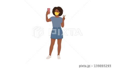 African American Woman Wearing Yellow Mask Taking Selfie African American Woman Wearing Yellow Mask Taking Selfie 139893293