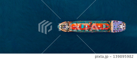 Aerial view Gas ship tanker vessel loading and unloading in oil terminal station refinery, Global business import export logistic transport sea freight cargo gas tanker ship, Red gas tanker ship at Aerial view Gas ship tanker vessel loading and unloading in oil terminal station refinery, Global business import export logistic transport sea freight cargo gas tanker ship, Red gas tanker ship at 139895982
