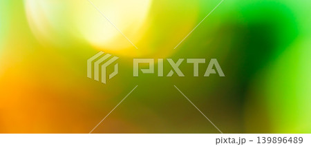 Vibrant abstract background with bold green yellow and orange blurred gradient for fresh tropical backdrop 139896489