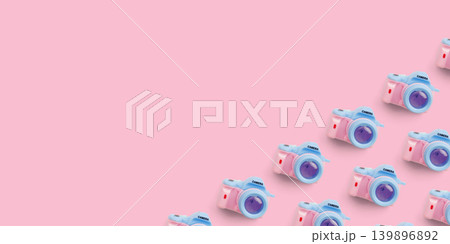 Pattern with SLR camera on pastel color background 139896892