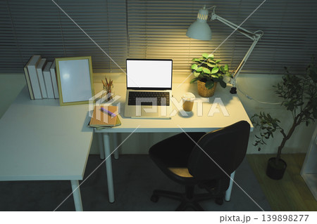Workspace with laptop mockup desk lamp and home office setup Workspace with laptop mockup desk lamp and home office setup 139898277
