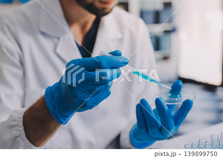 Lab technician experimenting in lab Lab technician experimenting in lab 139899750