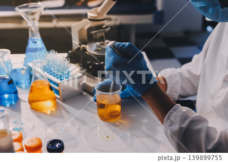 Lab technician experimenting in lab Lab technician experimenting in lab 139899755