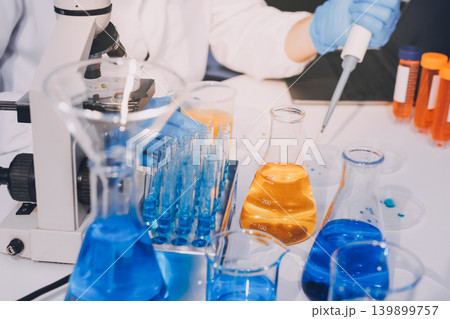 Lab technician experimenting in lab Lab technician experimenting in lab 139899757