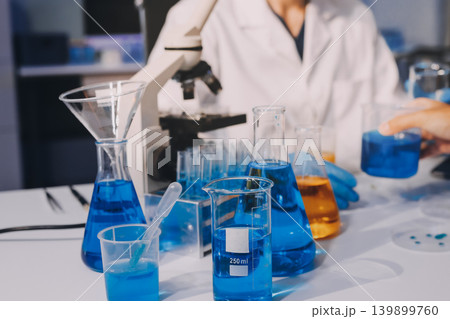 Lab technician experimenting in lab Lab technician experimenting in lab 139899760